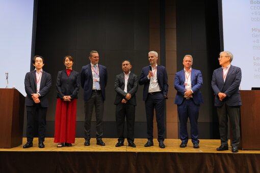 Group of people standing on stage.